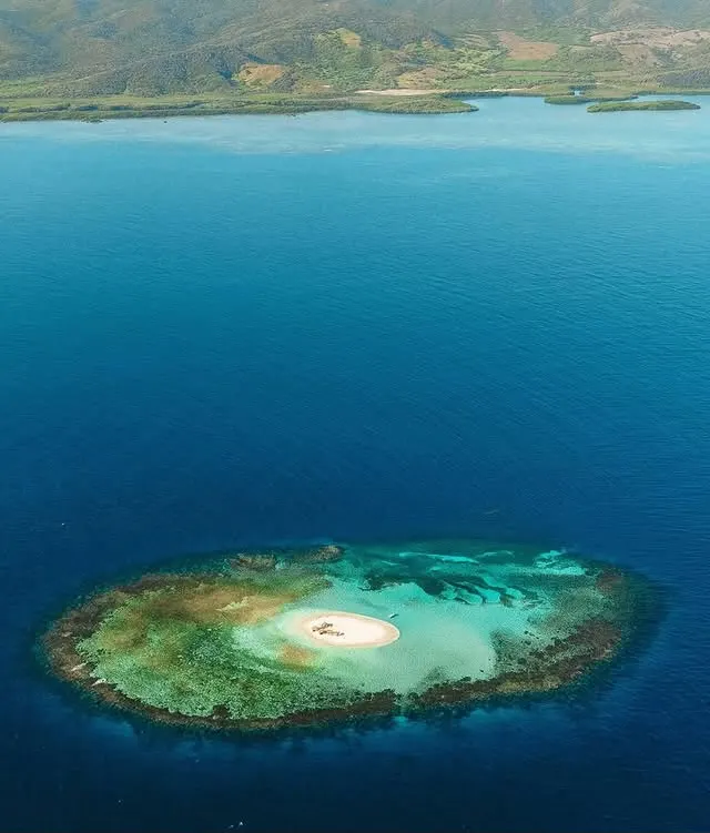 Cayo Arena reef seen from the air with the north coast behind